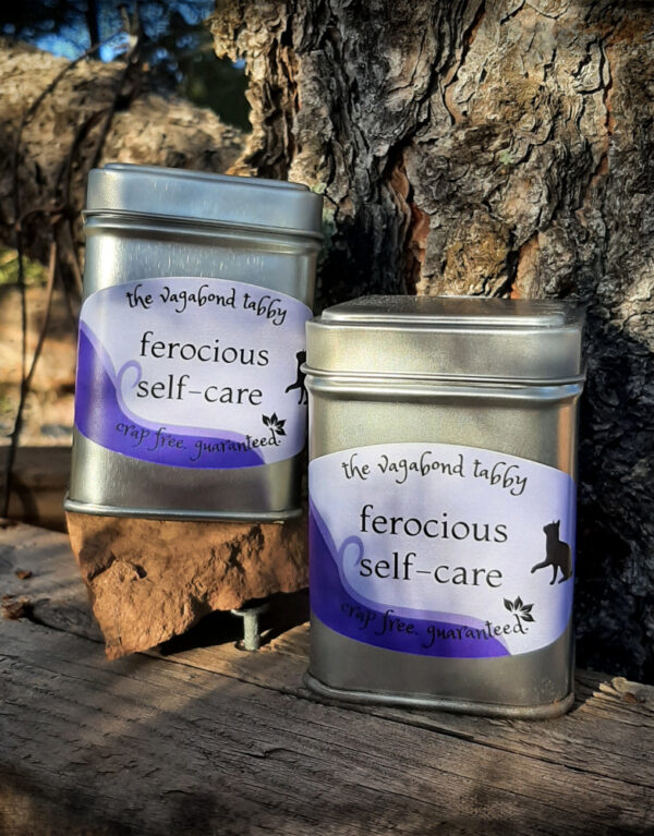 Two metal tins; the labels say ferocious self-care.