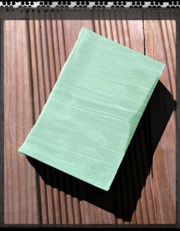 A bar of yellowish-green soap.