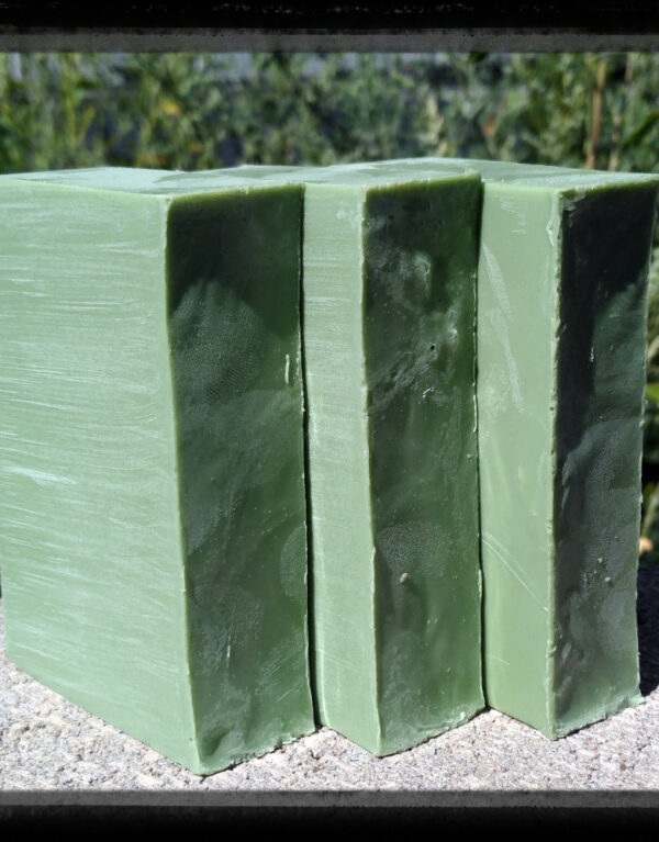 Three bars of yellowish-green soap.