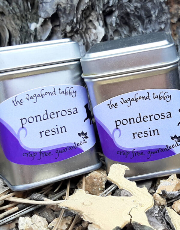 Two metal tins; the labels say ponderosa resin.