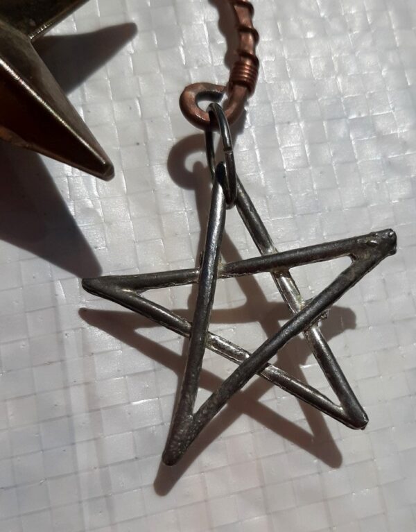 One of the smaller stars. They're made from interlaced wire, like a pentacle. They're silver-colored.