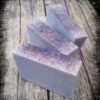 Three bars of blue-grey soap.