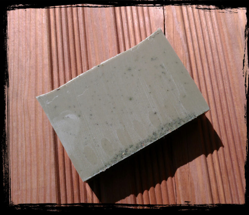 A bar of deep forest green soap.