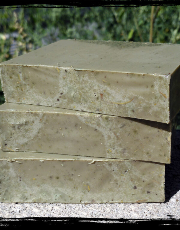 Three bars of deep forest green soap.