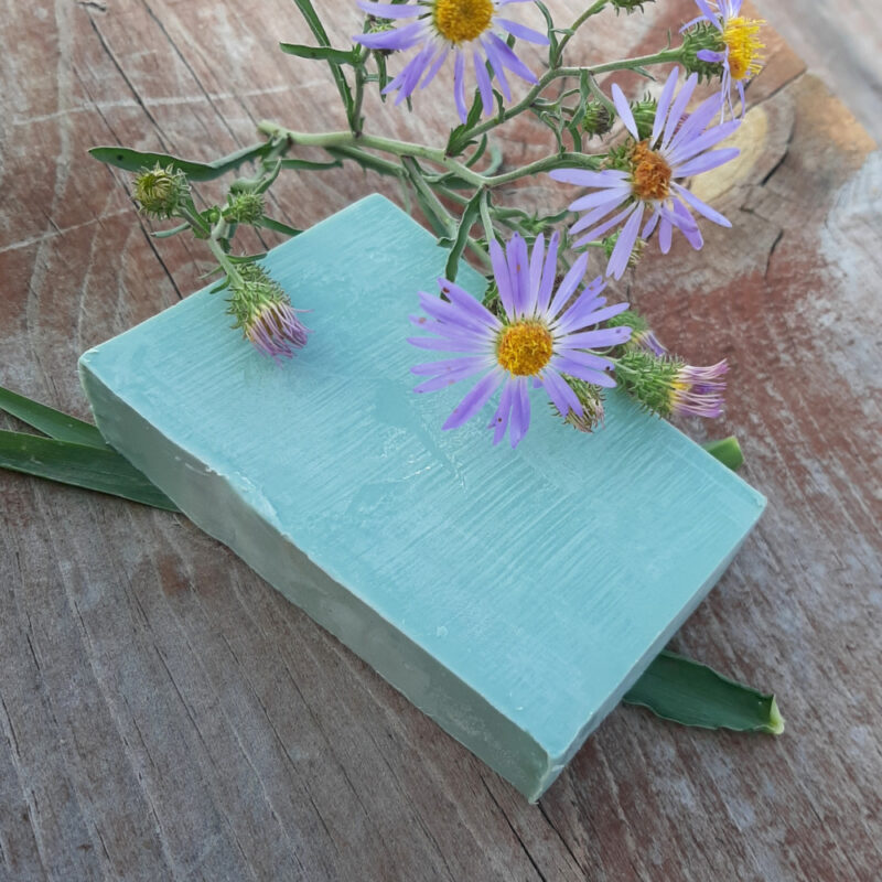 A single bar of softly green soap.