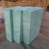 Three bars of softly green soap.